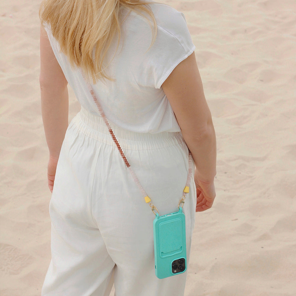 Wear a comfortable summer beach outfit with your turquoise beach phone case and matching nude and gold phone necklace chain.