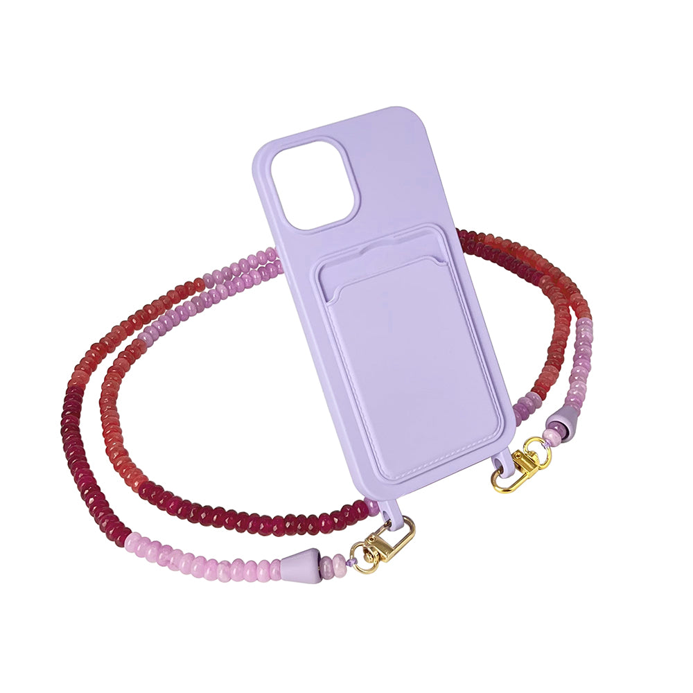 Matching set of a summer lilac phone case and berry red, purple, and pink gemstone phone chain necklace.