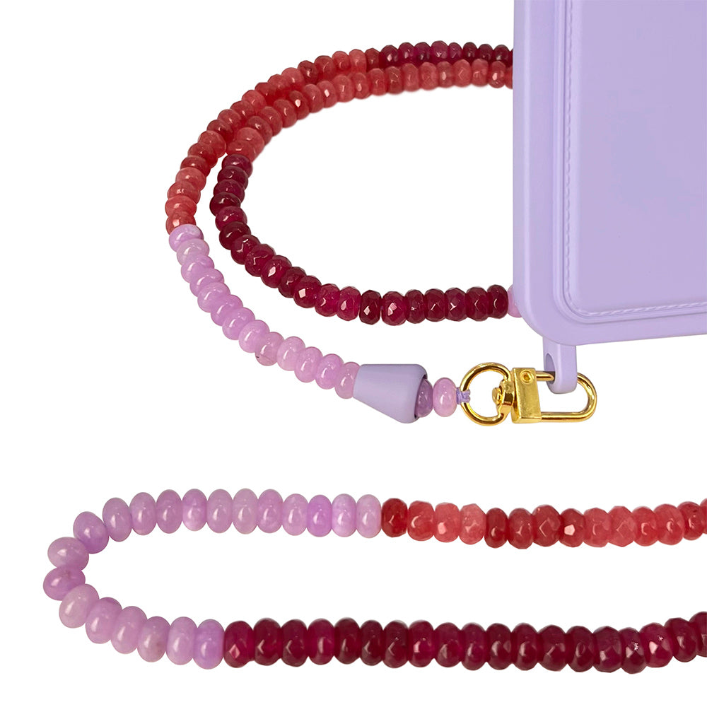 Summer berry red, pink, and lilac purple phone chain necklace with a matching lilac phone case that has a card slot and eyelets to connect with the phone chain.