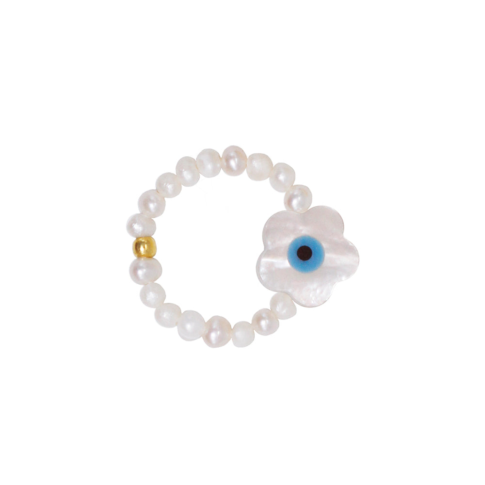 stretch ring with small white freshwater pearls and flower shaped nazar eye pendant out of nacre