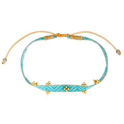 set of 2 bracelets with turquoise nylon band, small freshwater pearls and white and gold pearls