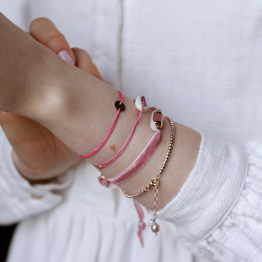pink nylon thread bracelet with round rosegold pendant