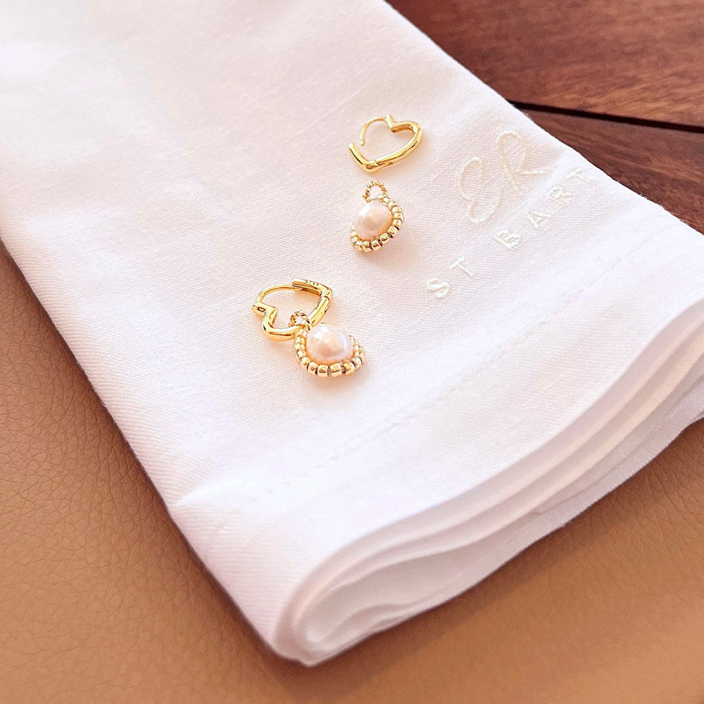Heart hoops 925 sterling silver 18K gold plated with genuine pearl shot in the iconic "Eden Rock" Beach Club in St. Barths on a branded ER napkin. 