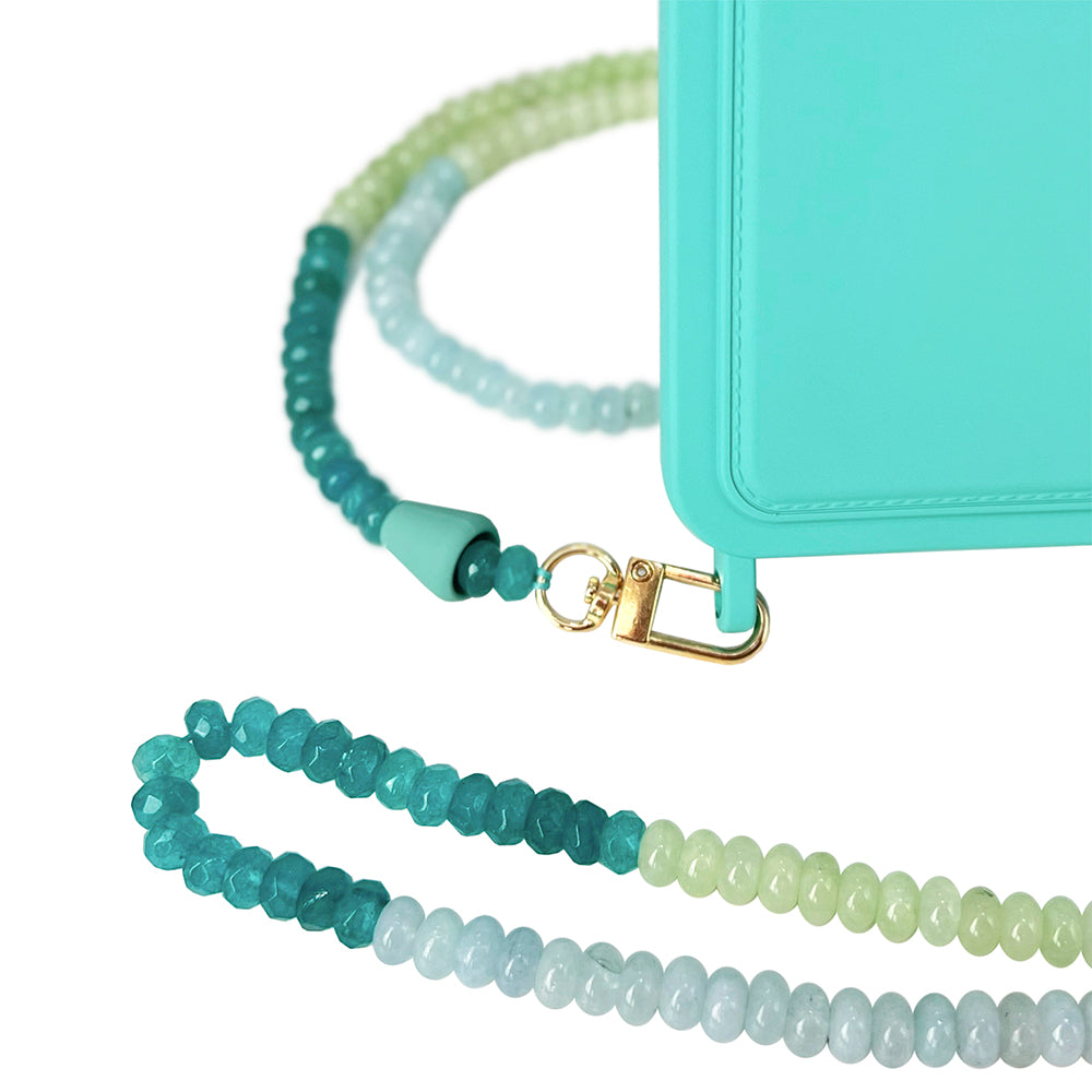 Turquoise phone chain necklace with ocean blue, sage green, and turquoise gemstones with a matching turquoise phone case.
