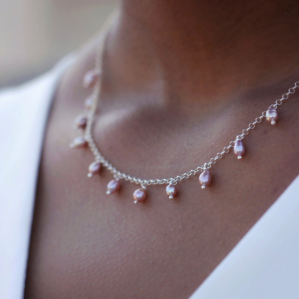 silver wedding necklace with small rose colored pearl pendants
