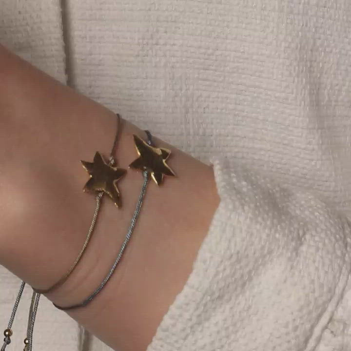 green nylon thread bracelet with gold plated starfish pendant
